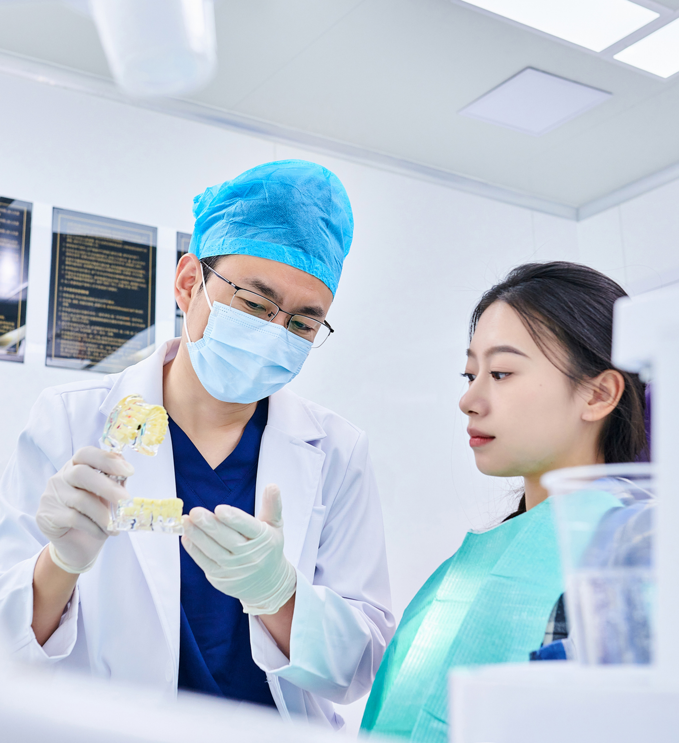 Dentist showing dental model to patient